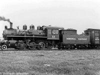 Roberval & Saguenay 2-6-0 #13 (a 2-6-0 "Mogul" Built for the R&S by MLW in 1927, disposition unknown) is pictured coupled to an old wooden CN boxcar, in Arvida QC circa 1940.<br><br>Bill Thomson collection photo (photographer unknown).