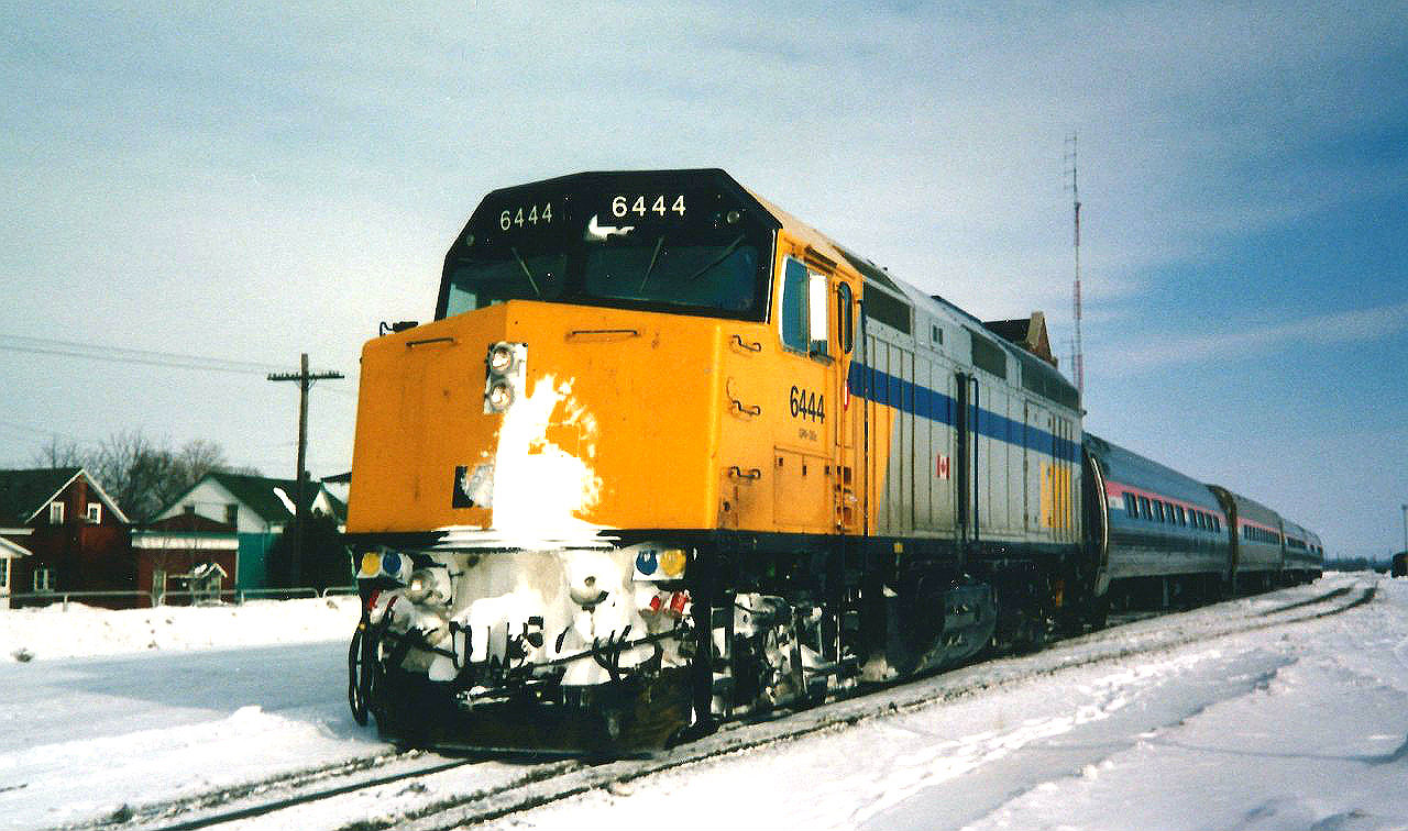 The westbound International is viewed departing Stratford with VIA Rail 6444 at 14:00 for Sarnia and the US. Not long after the passenger train cleared  the junction, a Goderich-Exeter Railway drag came off the shortline's Goderich Subdivision with borrowed Cape Breton & Central Nova Scotia Railway (CBNS) C630M 2035 and leased GATX GP40G 3080, which was a former Burlington Northern unit.