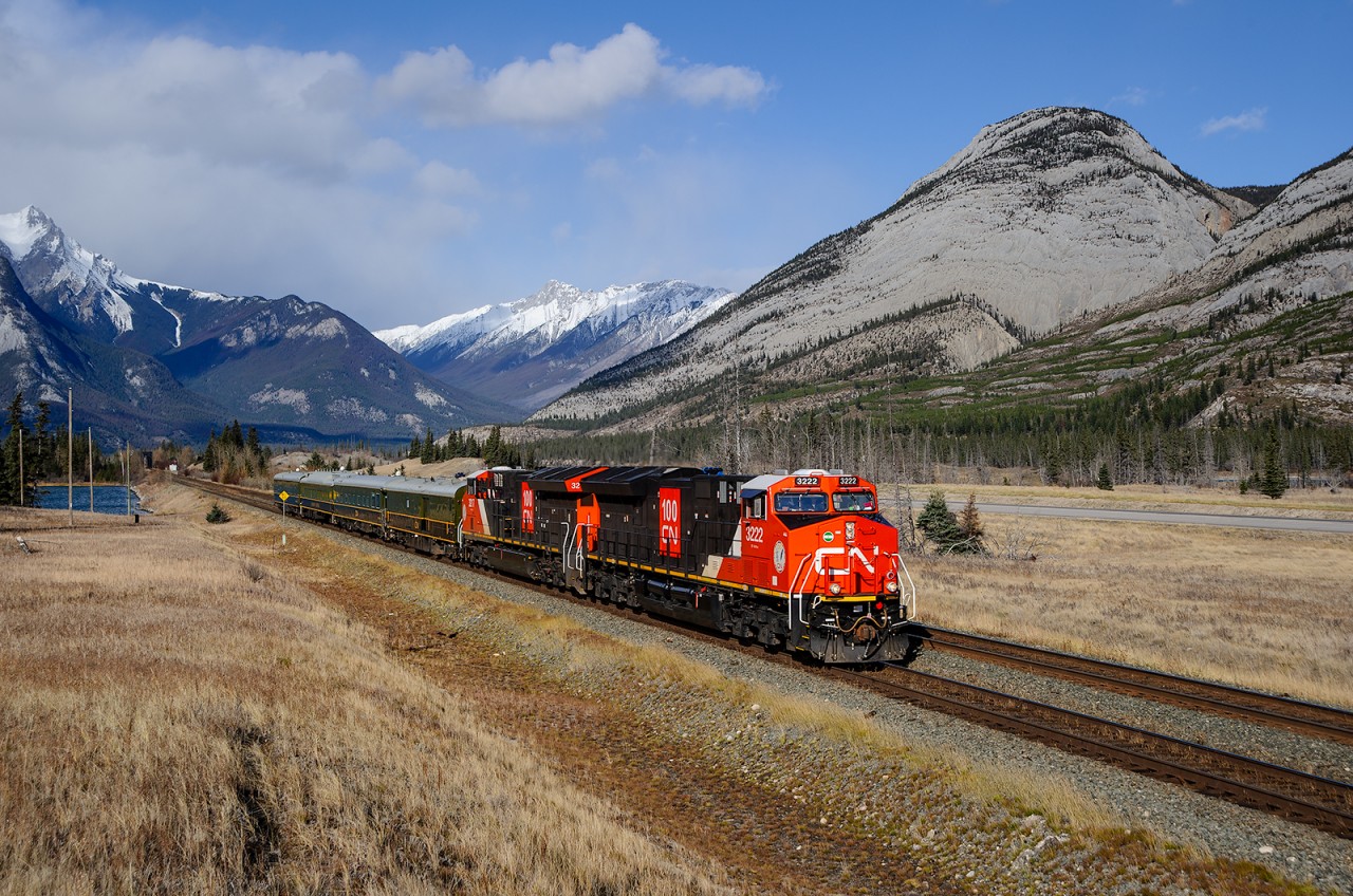 CN ET44ACs 3222 and 3217 speed towards Jasper with short passenger train P01351 18 in tow. They're bringing quite a large group of people to Jasper for the Grand Opening of the Jim Vena stage which will feature The Jim Cuddy Band performing a concert.