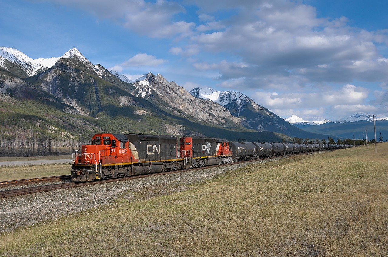 An oldie, but goodie. CN SD40us 6022 and 6013 hustle train M310 eastward at Henry House on CN's Edson Sub.