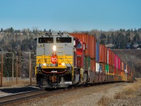 After waiting for train 200-24 ahead to change crews and depart Calgary onto the Red Deer Sub, 100-24 finally gets back on the move at Brickburn where it had been holding for about 30 minutes clear of crossings.