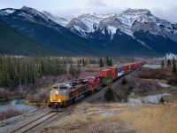 Wearing CP's new "Block" heritage scheme, CP SD70ACU 7015 leads Vancouver IMS-Toronto Yard train 100-24 east on CP's Laggan Sub just east of the siding at Exshaw.