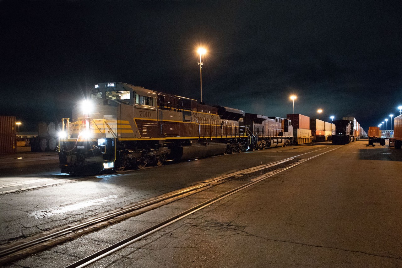 CP 7010 looks superb under the lights of CP's Vaughan Intermodal Terminal. The remote unit is already placed, and 7010's Cando crew is about to pull forward with the headend of 101.  Next, they will back onto the remote, perform all the train and communication checks, pull the entire consist to the departure end of the yard and hand the train back to the waiting CP crew.
