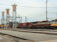 A pair of train consists on the servicing tracks including script heritage SD70ACu 7010.