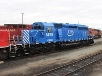 Ex CP SD40-2 5879 in transit through Agincourt for Cenex Harvest States Cooperative.