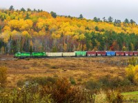A pair of green power lead NBSR 907 at Clarendon, New Brunswick with a bit of Fall colors left in the hills.