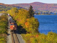 An SD75i, CN 5665, is in charge of eastbound train 306, rumbling by the scenic Lac Baker, New Brunswick, about 10 minutes east of the Quebec/New Brunswick border. This area of New Brunswick is great to shoot at almost year round, but Fall is when it's the nicest. 