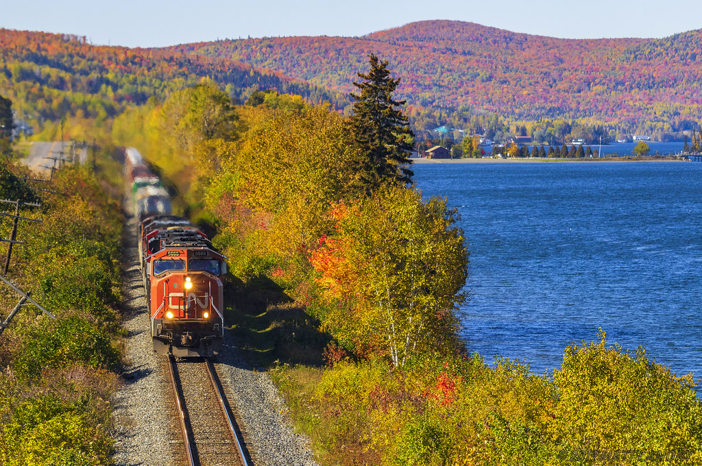 An SD75i, CN 5665, is in charge of eastbound train 306, rumbling by the scenic Lac Baker, New Brunswick, about 10 minutes east of the Quebec/New Brunswick border. This area of New Brunswick is great to shoot at almost year round, but Fall is when it's the nicest.
