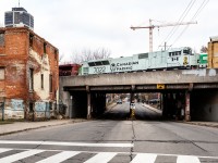 Wearing the grey, red and black colour pattern of modern Canadian and American warships, Canadian Pacific 7022 rumbles through Hamilton's gritty backstreets aboard (Frontier Yard) Buffalo, NY to (Agincourt Yard) Toronto, ON train # 247.