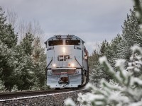 Complete with a two-tone grey paint scheme designed after the livery applied to Canadian and American fighter jets, CP 7023 triumphantly hauls Vancouver to Montreal stack train no. 112 down the Mactier Subdivision at Craighurst, Ontario, on her maiden voyage across the country.