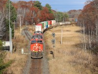 CN 105 rounds the bend at CN Falding with 155 intermodal cars.  The train would soon come to a complete stop while they attempted to contact the CP RTC to obtain clearance on the CP Parry Sound Sub so they could enter the DRZ at Boyne/Reynolds.