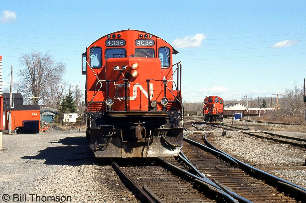 CN GP9RM's 4036 and 4141 are shown between assignments in the yard at Coteau, Quebec (at the junction of CN's Kingston Sub and Valleyfield Sub) in April 1998. CN rebuilt its GP9 fleet in the 80's and 90's to serve as roadswitchers for yard, local, and road service, and many have continued to operate under CN to this day, some at 60 years old and over.
