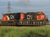 The chores are finished for this crew in the Strathcona area. Passing over the east leg of the wye and onto the Clover Bar service track, the shop track is not far off and they will head home for some sleep after working all night.