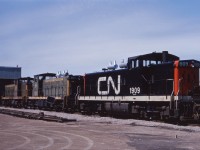 Three steam generator equipped GMD1s (1909, 1911, and 1915) sit outside the almost completed Diesel Shop in Hamilton in the spring of 1964. These units likely came into town on the evening commuter trains and will return to Toronto on Monday morning. Note the difference in frame striping between the 1911 and 1915!