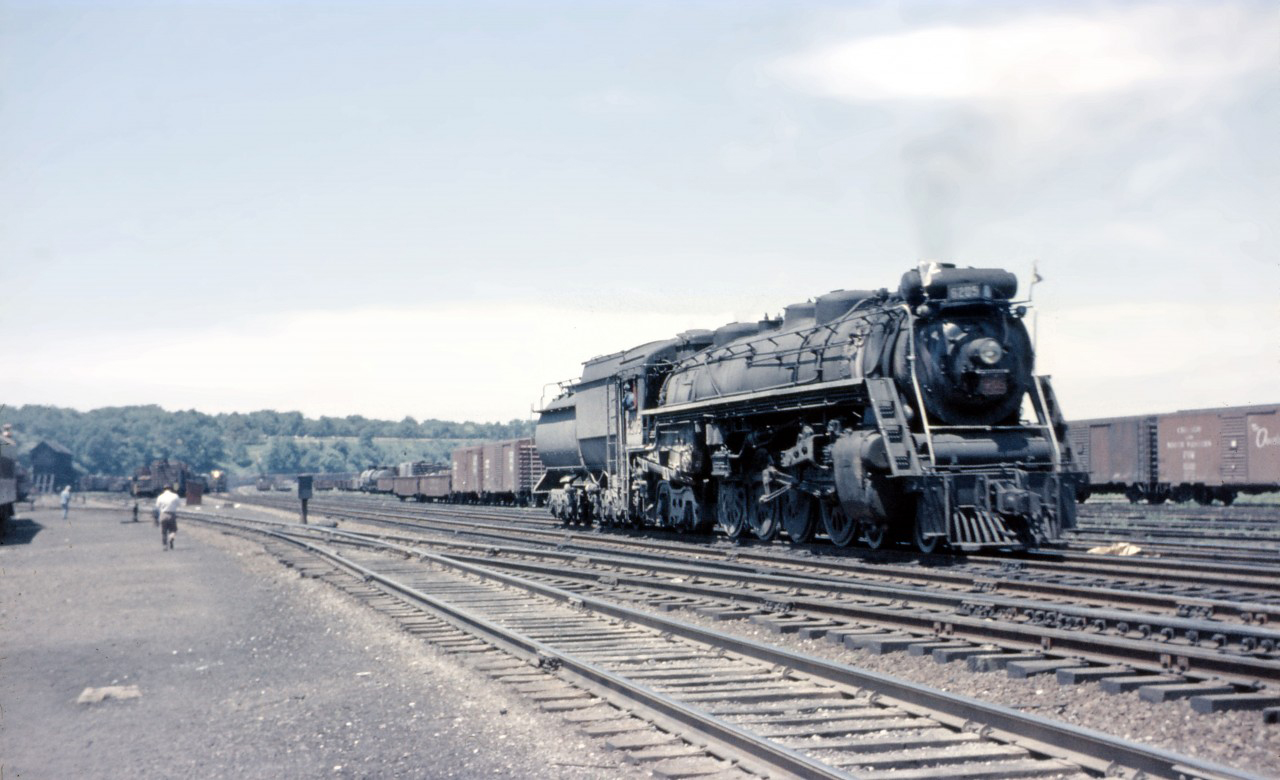 By June 1959, steam power was only to be used on an "emergency basis" on CN's Central Region. So catching Northern 6205 backing through Hamilton Yard was an unexpected treat...perhaps she had to make a stop at the shops or coaling dock (seen in the background). Also note the diesel-powered train in the South Yard.