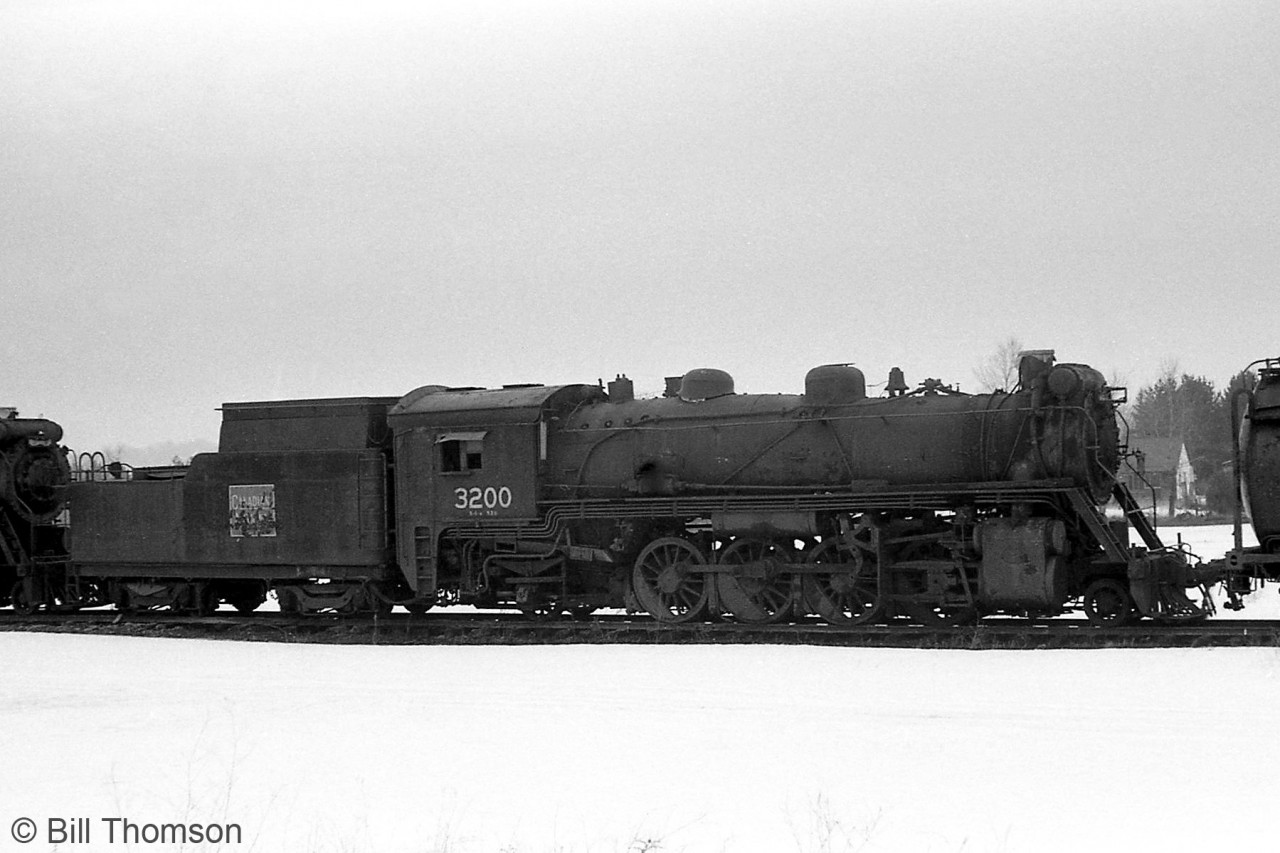 Canadian National S1a-class "Mikado" 3200 sits in the scrap line at Barrie in 1964, awaiting the cutting torch with other retired steam engines. CN 3200 was originally build by CLC in Kingston as Canadian Government Railway 2800 in 1916. It later became Canadian National 3200 in 1919.