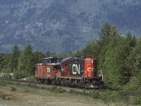 CN 7049, an EMD GP9RM built in 1957, is headed east and approaching Hope with Caboose 79873 at Cheam View, on CN's Yale Sub. Not sure of exactly when but, Caboose 79873 was put out to pasture at the Woodlands and Meadows Perennial Nursery & Gardens in Princeport, Nova Scotia. GPS is approximate.