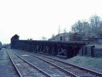 With steam operations having ceased almost a year ago, the massive coaling tower in Hamilton stands idle in this shot from May 1960.