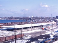 As the winter sets in, the new Express Building and Carload Centre is nearing completion on the site of the now demolished roundhouse at Stuart Street Yard. This facility will replace CN's Express Sheds on Ferguson Avenue and also house other employees involved in yard operations. Note the "shed tracks" on either side of the building and the team tracks on the left (occupied by work equipment). The gondolas of steel are for Stelco's Ontario Works (not in the picture).