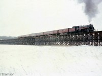 Here's another view of Canadian Pacific Royal Hudson 2857 with its short fantrip excursion train, on the giant 2142' long wooden Hog Bay trestle, during a photo runby stop just outside of Port McNicoll on CP's Port McNicoll Subdivision. Note the open doors on the baggage car with wood blocking, allowing riders a chance to lean out and witness the sights, sounds and smells of riding behind a live steam engine up close.
<br><br>
Planned photo stops and runbys such as this were common during excursions, as they allowed passengers and attendees a chance to hop off to photograph the train they were riding at different points along the line, and then re-board and resume the excursion again. Often times, they were planned for notable points along the line, including landmarks such as bridges, stations, junction points and the end terminus of the line (such as the visit to Port McNicoll during the trip to visit some of CP's <a href=http://www.railpictures.ca/?attachment_id=22492><b>last steam engines in regular freight service</b></a>).
<br><br>
A wider view of the bridge and train can be found here: <a href=http://www.railpictures.ca/?attachment_id=24230><b>http://www.railpictures.ca/?attachment_id=24230</b></a>