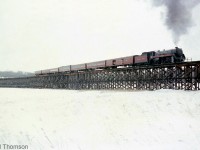 Here's another view of Canadian Pacific Royal Hudson 2857 with its short fantrip excursion train, on the giant 2142' long wooden Hog Bay trestle, during a photo runby stop just outside of Port McNicoll on CP's Port McNicoll Subdivision. Note the open doors on the baggage car with wood blocking, allowing riders a chance to lean out and witness the sights, sounds and smells of riding behind a live steam engine up close.
<br><br>
Planned photo stops and runbys such as this were common during excursions, as they allowed passengers and attendees a chance to hop off to photograph the train they were riding at different points along the line, and then re-board and resume the excursion again. Often times, they were planned for notable points along the line, including landmarks such as bridges, stations, junction points and the end terminus of the line (such as the visit to Port McNicoll during the trip to visit some of CP's <a href=http://www.railpictures.ca/?attachment_id=22492><b>last steam engines in regular freight service</b></a>).
<br><br>
A wider view of the bridge and train can be found here: <a href=http://www.railpictures.ca/?attachment_id=24230><b>http://www.railpictures.ca/?attachment_id=24230</b></a>