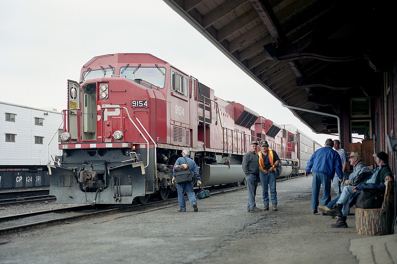 Always a lot of activity around the division-point Crew Change stop at Cartier. Here, crews meet and gab as they quickly change and get the train moving again. Westbound into the Nemegos Subdivision, CP 9154 and 9126, a couple of SD90MACs, are ready to roll.
Times have changed since I have been up there, crew quarters were outdated, and I think change takes place now at a new modern facility a hundred yards or so south of the station.
The station is under Heritage protection.