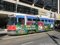 Sporting a brightly coloured advertising wrap for Stonyfield Farm Organic Yogurt, TTC CLRV 4003 pauses to load passengers at the corner of Dundas Street and Bay in downtown Toronto, enroute to Dundas West Station in the Junction area. 4003 was one of the original six Swiss-built SIG CLRV streetcars (cars 4000-4005), which preceded the regular Canadian-built production CLRV's built by Hawker Siddeley/UTDC (4010-4199).<br><br>Nearly 10 years have passed since this photo, and the aging CLRV fleet that dates from the late 70's have managed to hang on longer than most have expected. There had been plans in the works years ago for a CLRV rebuild program, but that was nixed in favour of buying all-new replacement low-floor accessible cars, which were supposed to arrive much sooner and replace the CLRV fleet. When delivery delays and quality control issues arose with the new Bombardier LRV cars and delayed the TTC's replacement schedule, much of the CLRV (and ALRV) fleet was kept going longer than planned despite age-related reliability issues and cold weather breakdowns. <br><br> The final few CLRV's are expected to be retired by the end of 2019, but a few have managed to elude the scrapper's torches and ended up in museums. Car 4003 here (one of the six SIG cars), along with 4010 (the first HSC/UTDC Canadian-built car), 4039 and articulated ALRV 4204 have all been preserved at the Halton County Railway Museum in Milton. Car 4034 has been donated to the Illinois Railway Museum in the US (a relatively modern streetcar addition to their collection). The TTC has retained ALRV 4207, and it is expected that they will keep one, two or three CLRV's of their own when the final cars retire.