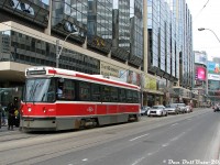 Not quite the perfect time machine shot, but contrasting this <a href=http://www.railpictures.ca/?attachment_id=39451><b>April 1983 view</b></a> of Dundas & Bay is this April 2009 view: TTC CLRV 4017, showing some wear from the nearly three decades of regular service she's given the City of Toronto, pauses to load passengers on a westbound Rt.505 Dundas run. The Atrium on Bay remains nearly unchanged, but the explosion of development around Dundas Square has created a wall of glass and advertisements in the distance at the north-east corner.<br><br>Since the last PCC's retired from service in the mid-90's, the CLRV and ARLV fleet had been the sole streetcar equipment in regular use on the system (until the new Bombardier cars started entering service in 2014). 4017 would soldier on for nearly another decade in service until retirement in October 2017, at the ripe old age of 38 years old.