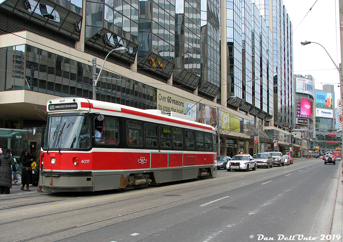 Not quite the perfect time machine shot, but contrasting this April 1983 view of Dundas & Bay is this April 2009 view: TTC CLRV 4017, showing some wear from the nearly three decades of regular service she's given the City of Toronto, pauses to load passengers on a westbound Rt.505 Dundas run. The Atrium on Bay remains nearly unchanged, but the explosion of development around Dundas Square has created a wall of glass and advertisements in the distance at the north-east corner.

Since the last PCC's retired from service in the mid-90's, the CLRV and ARLV fleet had been the sole streetcar equipment in use on the system (until the new Bombardier cars started entering service in 2014). 4017 would soldier on for nearly another decade in service until retirement in October 2017, at the ripe old age of 38 years old.