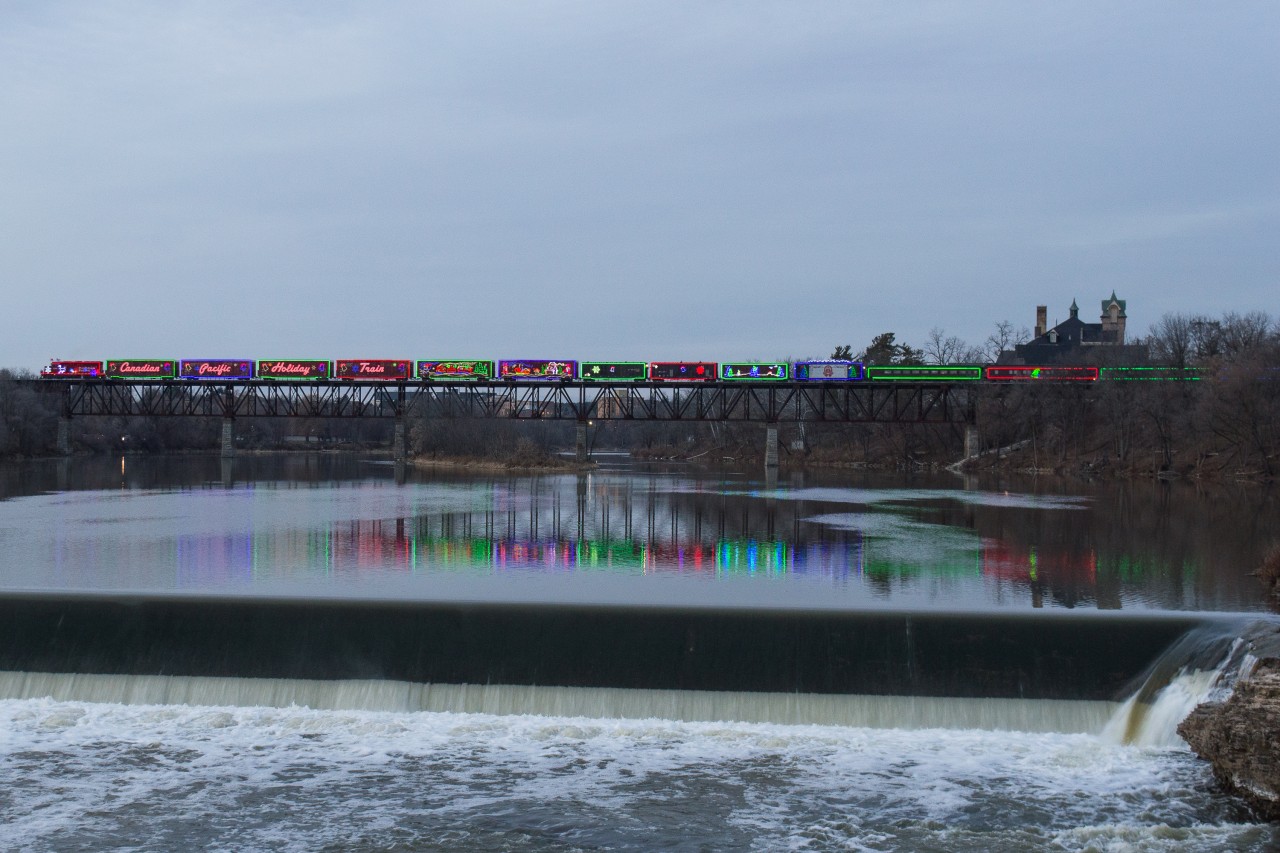 The Canadian Pacific Holiday Train crosses the Grand River at Galt on a brisk November evening.  I enjoyed seeing all of the people standing on the bridge and along the riverbank to take in the scene of the train crossing the impressive bridge, it shows the power of the holiday season.