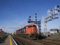 CN 310 with CN 5617 and CN 2548 passes two sets of signal gantries at Dorval Station on a sunny but cold morning, with the one at left living on borrowed time. Get your shots of CN's SD70I's while you can, as it is rumoured that they will be rebuilt as SD70ACC's in the near future.