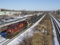 CP 9712 and a multimarked but heavily tagged hopper bring up the rear of ethanol train CP 650. Hard to believe it's the middle of November, with quite a bit of snow on the ground and very frigid temperatures today.