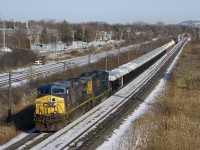 CSXT 400 and CSXT 4049 lead a short CN 327 (63 cars) through Pointe-Claire. Up front are a long string of gons (both new and old ones) containing zinc ore that will be set off at Coteau.