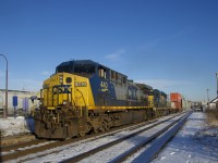 CN 327 has just 51 cars (including two intermodal cars up front) and CSXT 440/CSXT 4000 for power as it passes through Dorval. CP 143 is barely visible at left, its head end having passed just a short time before.