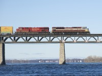 Leading CP 253 into Montreal for the second time in three days, heritage unit CP 7010 is almost onto the island of Montreal on a sunny morning. Trailing is CP 8902.