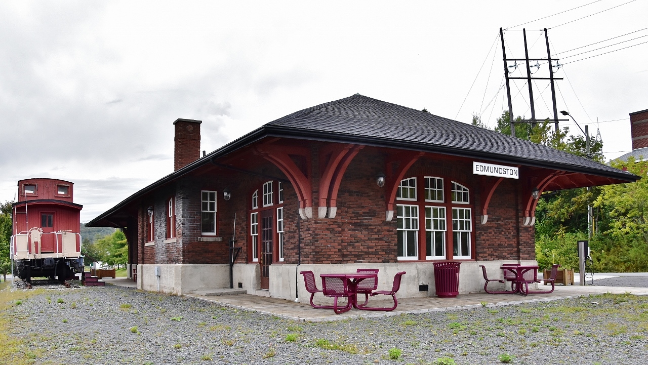 The restored  ( 2005 )  Edmundston CPR station originally built by the CPR circa 1930, from plans supplied by the office of the CPR’s Chief Engineer in Montreal.
  
  
 Restoration included retaining much of the original interior room and related woodworking. 
  
  
The station is a  Regional Information Center and the Edmundston Madawaska Tourism Office. Current transportation uses include a cycling trail rest stop and an electric vehicle recharge station, 
  
  
what's interesting
  
  
The 1930 station replaced a two story station built by a predecessor railway, the New Brunswick Land and Railway ( 1881 name change to New Brunswick  Railway ). 
  
  
CPR sold off most N B assets * (timber lands and railway lands, rights of way)  by 1941 to the Irving group, retaining operational rights. Most CPR  N.B. service ended circa 1987, * excepting CAR (McAdam) line.
  
  
The caboose: moved to CP Edmundston station location 2008 is ex CPR Angus built wood  caboose (number unknown) formerly at Grand Bay – Westfield N B ( thank you Trackside Guide)
  
  
September 5 2019 digital by S.Danko at Edmundston N.B.