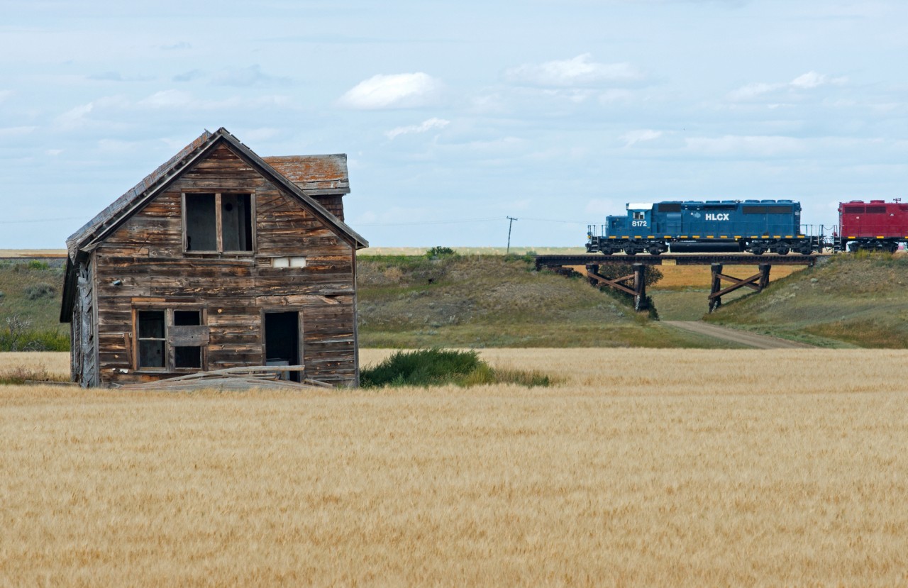 Available railfan real estate! Great Sandhills Railway crosses one of few bridges on the Empress Subdivision in the backyard of an old farmhouse. Currently the entire 83.9 mile GSR Empress sub is 10mph which makes for a less than exciting chase, but there are certainly some interesting surroundings to include in one's photo.