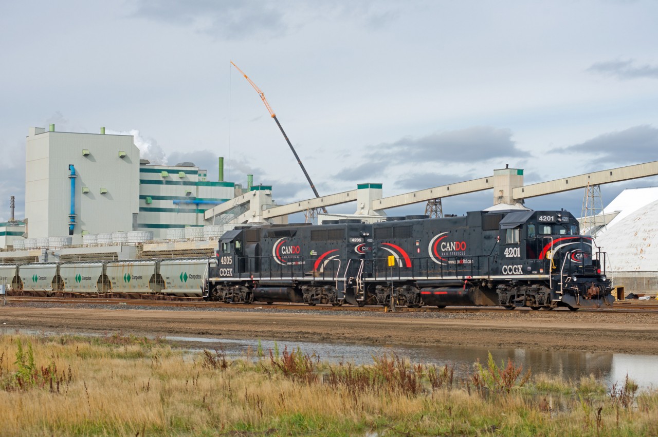 The Mosaic potash mine near Belle Plaine Saskatchewan is situated between the CP Indian Head Sub and the CN Central Butte Sub. While both class ones have access to the mine, the switching is performed by Cando. CCGX 4201 and 4205 are exDTI and MEC and are seen here between tasks.