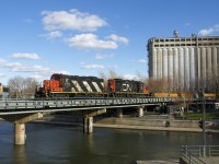 CN 4129 & CN 7032 lead a short train of baretables into the Port of Montreal.