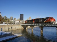CN 3869 & CN 3101 lead a later than usual CN 149 out of the Port of Montreal on a very cold but but very sunny morning. Montreal had gotten over half a foot of snow the day before, though some trees have still not shed their leaves.