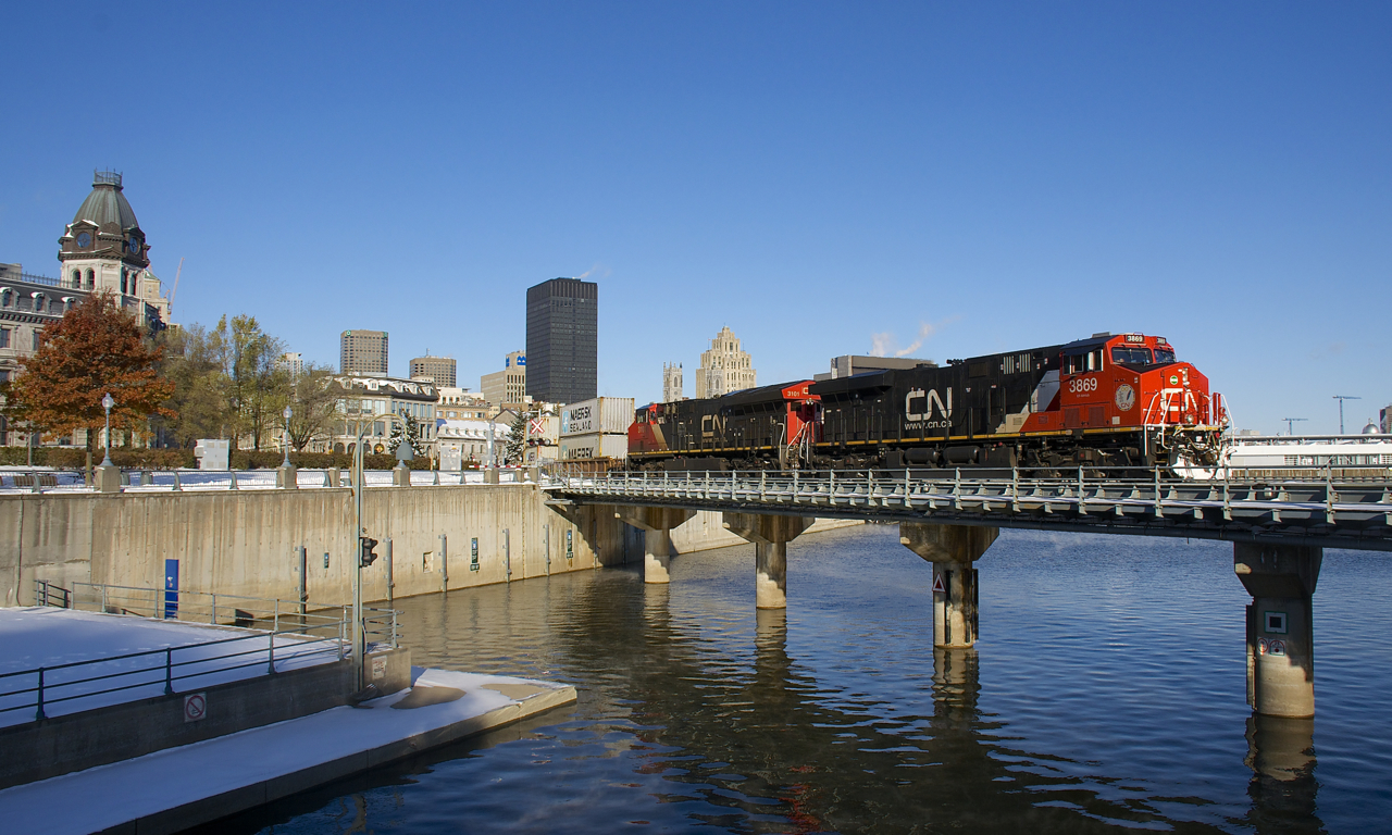 CN 3869 & CN 3101 lead a later than usual CN 149 out of the Port of Montreal on a very cold but but very sunny morning. Montreal had gotten over half a foot of snow the day before, though some trees have still not shed their leaves.