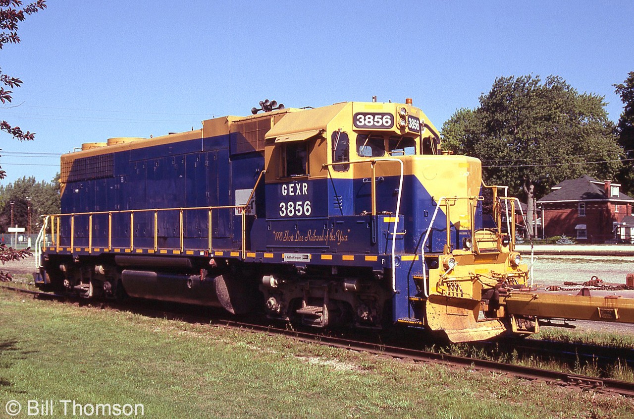 Another one of Goderich Exeter Railway's hand-me-down 4-axle units, GEXR GP38 3856 works at Stratford in August 2002. It has been restenciled and renumbered for GEXR, but still sports the blue and yellow of former owner New England Central RR, a railroad in the RailAmerica family (who also owned GEXR). It was originally Gulf, Mobile & Ohio 720, and worked for Illinois Central before becoming NECR 9539. GEXR 3856 was eventually transferred up north to the Ottawa Valley Railway, and sent for rebuilding as RLK 2054.