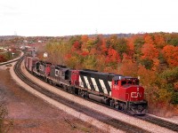 It has been a long time since this image was captured, but the view off the hillside at the old Hamilton West gathering spot has not really changed all that much. Power has long retired/rebuilt and track speed has increased. In this view an unidentified CN eastbound rolls by behind CN 9492, 4572 and 4521. It is the height of fall colour mid-October in 1978.
Extra flags looking good. So are the old Geeps. One of my favourite models over the years.
