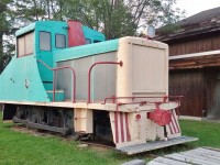 <br>  
<br>  
In front of  Le Musée des voitures d’autrefois fermera ses portes ( and adjacent to the entrance to Republique Provincial Park ) is ex Fraser Paper #5, a May 1942 built Plymouth 45 ton ( 'Flexomotive' per Trackside Guide).
<br>  
<br>  
Windows and side of the long hood replaced with translucent panels that are now well weathered. And it appears that the paint scheme is other than original.
<br>  
<br>  
Sept 6 2019 digital by S Danko at Saint - Jacques, N.B.
 <br>  
<br>
what's interesting
<br>  
<br>
On June 18, 2009 Fraser Papers Inc. and all subsidiary companies filed for protection from its creditors under the Companies' Creditors Arrangement Act ("CCAA") in Canada and in the USA for protection pursuant to Chapter 15 of the US Bankruptcy Code in the United States. 
<br>  
<br>
sdfourty