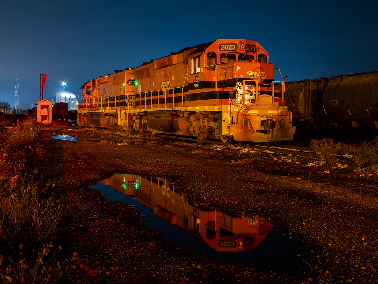 GEXR 581's power rests in the yard in Stratford overnight. It was pretty cold, but neither engine was idling. The green lights I believe are from the APUs which kick in automatically when needed to keep things from freezing. 4001 was added to the fold in Stratford on this day, but it was buried pretty far back in the yard. Given it's been around for over a week now, I am wondering if anyone knows how it's factored into things there?