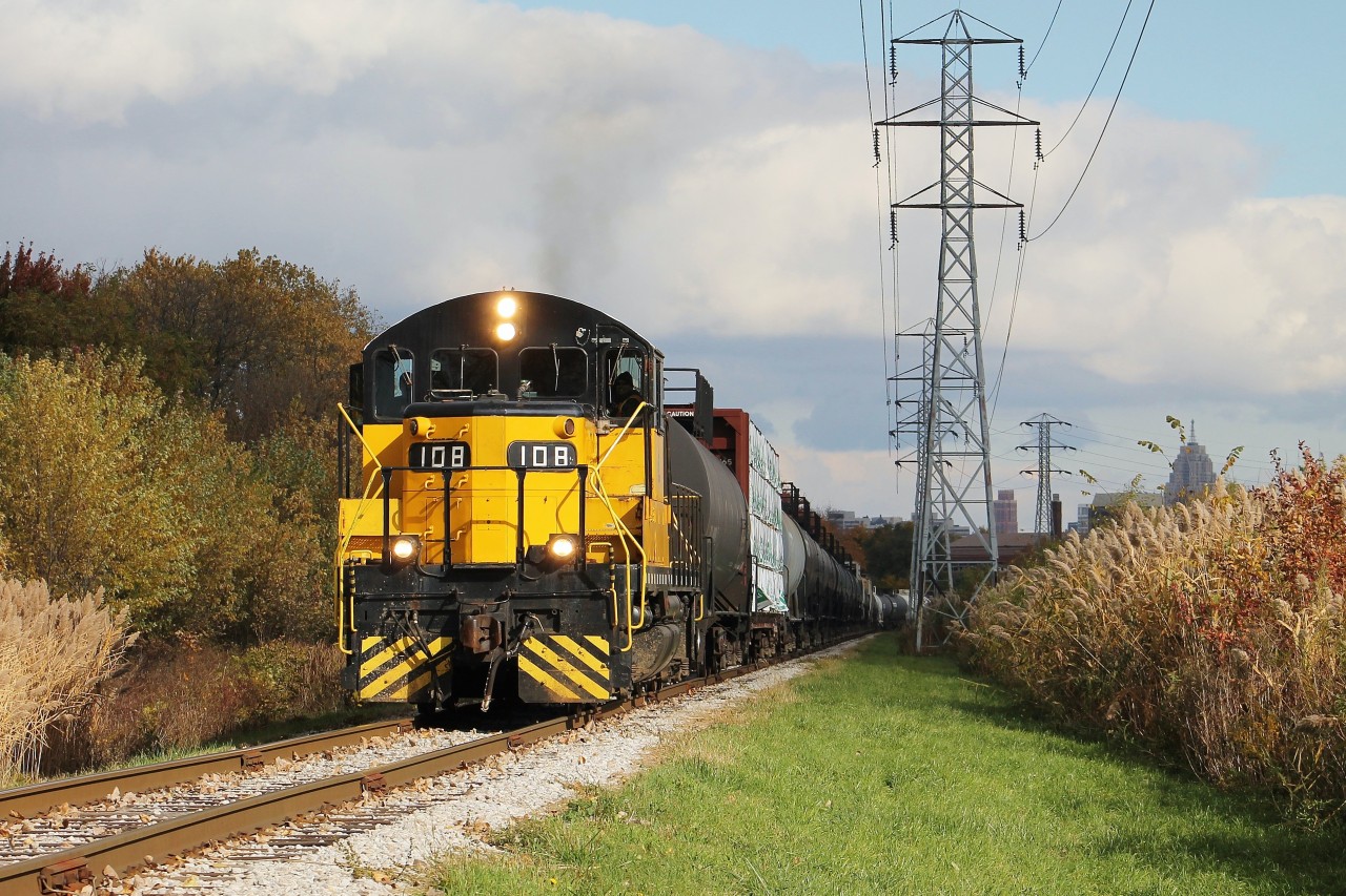 After making lifts from the CP and CN interchanges, the 0900 Essex Terminal crew prepares to work customers in the Ojibway Industrial Park and at the Port Authority of Windsor. At this location, the tracks curve slightly to the southwest which provides an opportunity to shoot late morning westbound movements in good light somewhere other than Ojibway Yard where the tracks run north/south. 108 is my favourite unit on ETR's small roster so I'm glad it was on this job rather than the 0700 job.