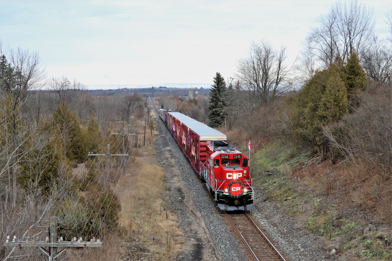 The country side of Puslinch provides the backdrop for the annual CP Holiday Train led by CP 2246 as it makes its way up the grade approaching the Highway 6 overpass. This is an excellent photographic spot but you sure take a chance with the traffic biting at your butt.