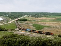 3 former NAR SD38-2's lead the eastbound wayfreight from Elgin to Winnipeg via Morris past the north end of Pelican Lake. This line was built by the Northern Pacific in 1889, subsidized by the Manitoba Provincial Government to break the CPR's monopoly on interprovincial traffic allowing grain to move via Emerson-Noyes to Duluth-Superior harbours. In 1898 the line was sold to the fledging Canadian Northern.
Existing sections are the Emerson to Winnipeg and Winnipeg Portage Lines. The Line from Morris to Brandon and a branch to Hartney were abandoned from the 1970's with the last section from Elgin to Morris abandoned in the noughts



































