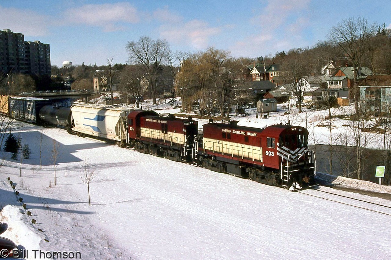 Ontario Southland RS23's 503 and 505 (ex-CP 8029 and 8021) are seen handling a freight on the Guelph Junction Railway, heading through Guelph running along the Speed River.