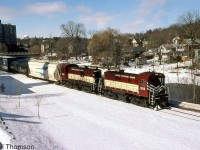 Ontario Southland RS23's 503 and 505 (ex-CP 8029 and 8021) are seen handling a freight on the Guelph Junction Railway, heading through Guelph running along the Speed River.